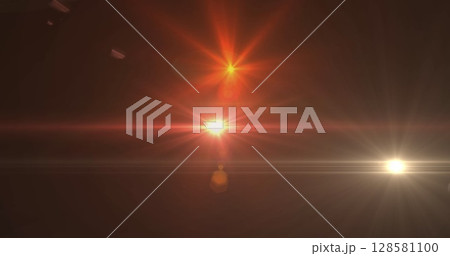 Image of glowing spots of lights over dark background 128581100