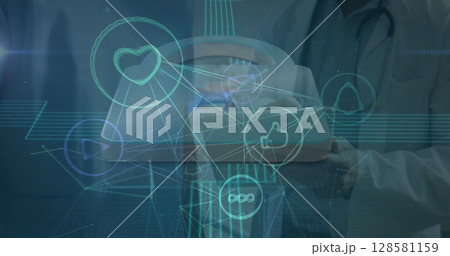 Image of network of connections with icons over diverse doctors 128581159