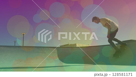 Image of colourful spots over caucasian man skateboarding Image of colourful spots over caucasian man skateboarding 128581171