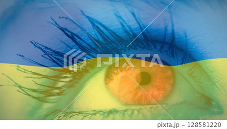 Image of flag of ukraine waving over open eye of caucasisan woman 128581220