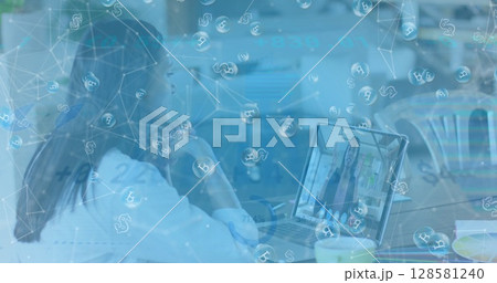 Image of bitcoin signs over caucasian businesswoman on laptop image call Image of bitcoin signs over caucasian businesswoman on laptop image call 128581240