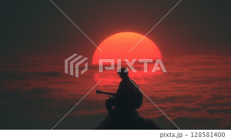 Silhouette of a musician playing guitar at sunset 128581400