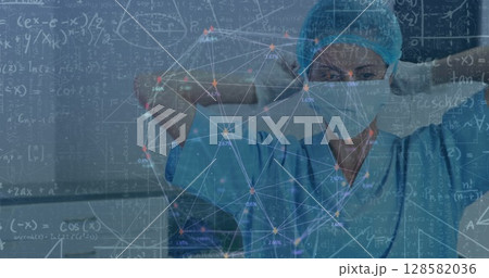 Image of scientific equations over caucasian surgeon in face mask Image of scientific equations over caucasian surgeon in face mask 128582036