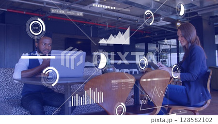 Image of data processing over diverse business people working in office Image of data processing over diverse business people working in office 128582102
