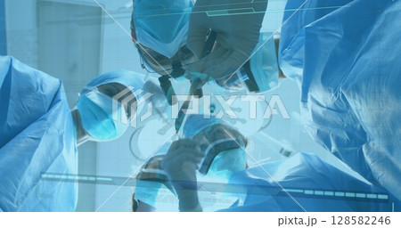 Performing surgical team operating on patient in operating room, with scalpel and camera overlays Performing surgical team operating on patient in operating room, with scalpel and camera overlays 128582246