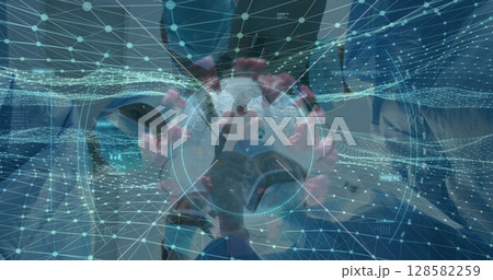 Masked doctor manipulating holographic coronavirus model in lab, with AR graphics and grid lines 128582259