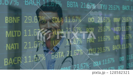 Image of financial data over happy caucasian male doctor Image of financial data over happy caucasian male doctor 128582321