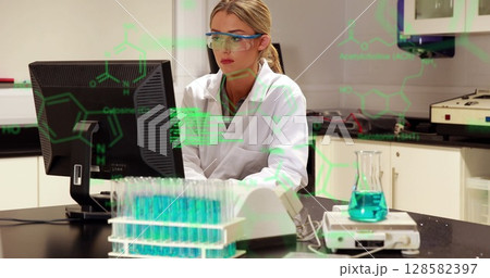 Image of scientific data processing over caucasian female lab worker using computer Image of scientific data processing over caucasian female lab worker using computer 128582397