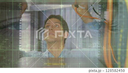 Image of data processing over computer servers and caucasian male it engineer 128582450