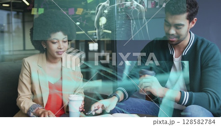 Screens with data processing against diverse male and female office colleagues discussing at office 128582784