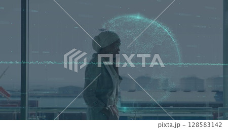 Image of financial data and globe over biracial businesswoman using smartphone Image of financial data and globe over biracial businesswoman using smartphone 128583142