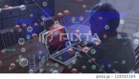 Working elderly man using laptop at home dining table, with papers and virus overlay, copy space 128583164