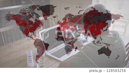 World map turning red icon over african american senior man having a imagecall on laptop World map turning red icon over african american senior man having a imagecall on laptop 128583258