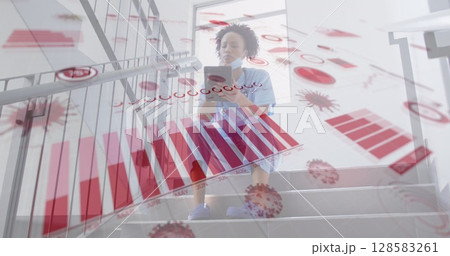 Image of financial data and virus cells over african american doctor using smartphone 128583261