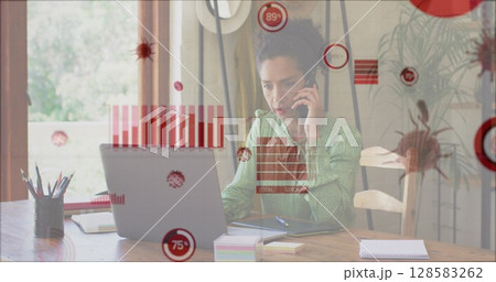 Image of covid 19 cells and statistics over biracial businesswoman using phone and laptop Image of covid 19 cells and statistics over biracial businesswoman using phone and laptop 128583262