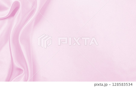 Smooth elegant pink silk or satin texture as wedding background. Luxurious valentine day background design Smooth elegant pink silk or satin texture as wedding background. Luxurious valentine day background design 128583534