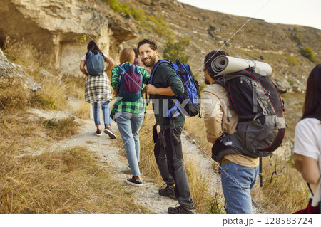 Portrait of a Happy Hiker Amidst Friends 128583724