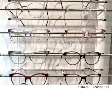 Large selection glasses frames on a shelf in a store Large selection glasses frames on a shelf in a store 128583841