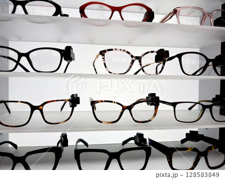 Glasses frames on a shelf in a store Glasses frames on a shelf in a store 128583849