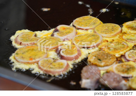 Korean Street Food Grilled Squid Stuffed with Noodles and Vegetables 128583877