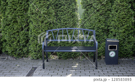 Metal bench in the park for smoke Metal bench in the park for smoke 128583893