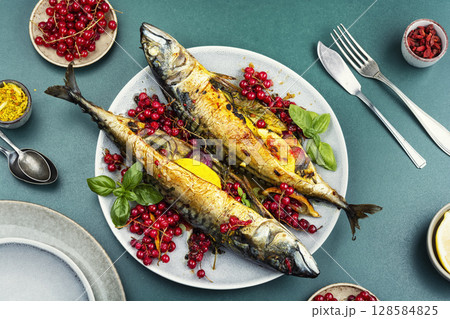 Aromatic fish baked in a berry marinade. 128584825
