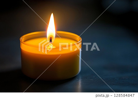 Soft Glow of a Candle Illuminating the Darkness in a Tranquil Space. Generative AI 128584847