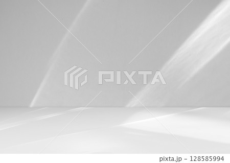Abstract white studio room with light and shadow from window background for product display presentation Abstract white studio room with light and shadow from window background for product display presentation 128585994