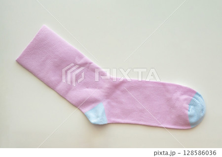 Purple cotton sport socks on white background 128586036