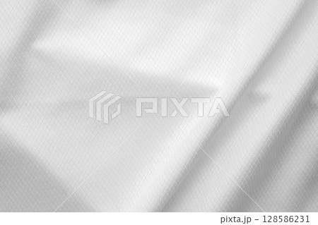 White sports clothing fabric football shirt jersey texture background White sports clothing fabric football shirt jersey texture background 128586231