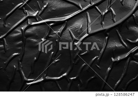 black crumpled and creased plastic poster texture background 128586247
