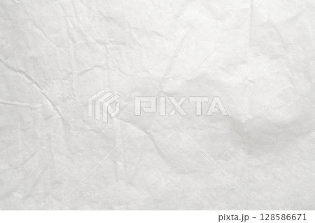 Abstract white crumpled and creased recycle paper texture background 128586671