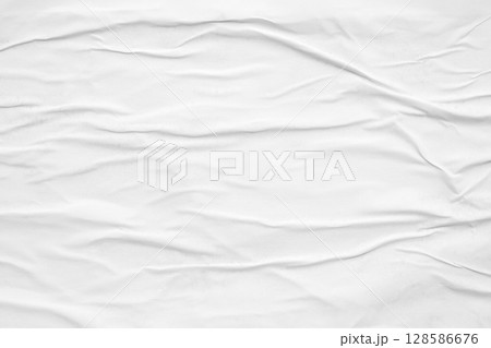white crumpled and creased glued wrinkled paper poster texture background 128586676