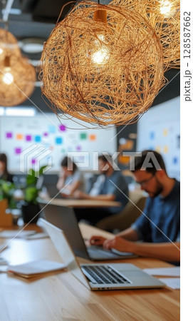 Data scientist explaining KPIs on whiteboard during product planning session in a modern co-working space. Data scientist 128587662