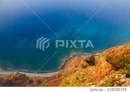 Madeira Island, Portugal. Breathtaking view from a coastal cliff Madeira Island, Portugal. Breathtaking view from a coastal cliff 128588395