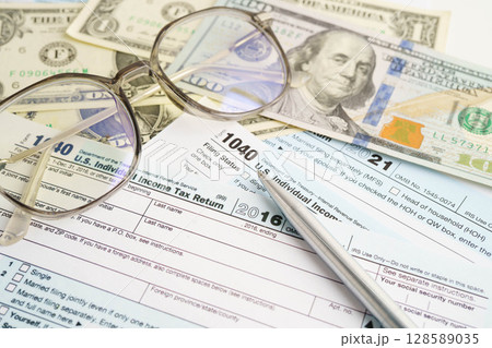 Tax form 1040 U.S. Individual Income Tax Return, business finance concept. 128589035
