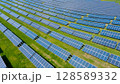 Rows of solar panels on a green meadow in Greece. 128589332