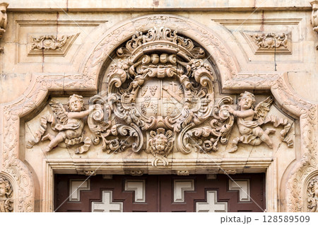 Ornate stone carving on historical building in Salamanca, Spain 128589509