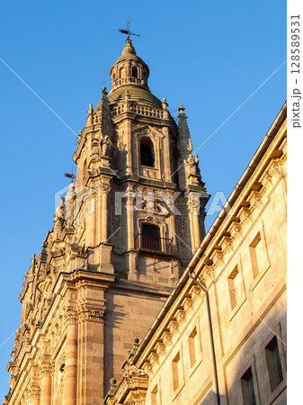 Stunning architecture of the historic tower in Salamanca, Spain against a clear blue sky 128589531