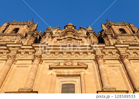 Stunning architecture of the historic tower in Salamanca, Spain against a clear blue sky 128589533