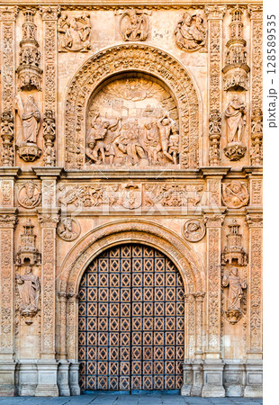 Ornate facade and wooden door in Salamanca, Spain 128589535