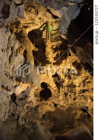 Exploring the unique rock formations and lighting in the caves of Betharram, France during an evening visit Exploring the unique rock formations and lighting in the caves of Betharram, France during an evening visit 128589727