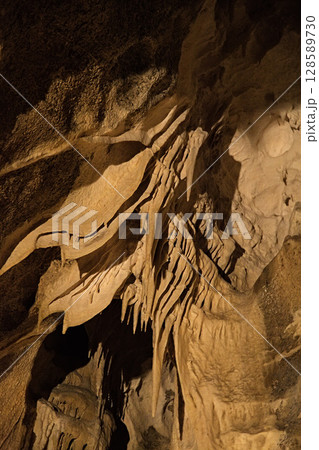 Rock formations of Betharram caves in France during a serene midday excursion Rock formations of Betharram caves in France during a serene midday excursion 128589730
