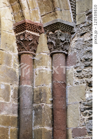 Columns of Abbey Church of Sainte-Foy in Conques, France, intricate stone carvings Columns of Abbey Church of Sainte-Foy in Conques, France, intricate stone carvings 128589810