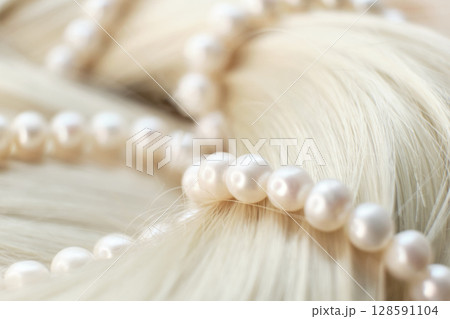 Unlocking the Secrets of Luxurious Hair: The Symbiosis of Pearls and Golden Locks in Haircare Rituals 128591104