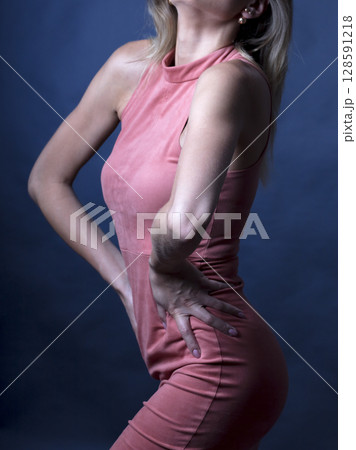 portrait of a young beautiful woman on a dark background portrait of a young beautiful woman on a dark background 128591218