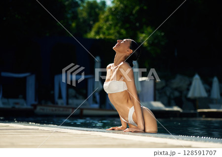 Enjoying the pool. Woman in white underwear 128591707