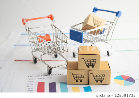 Online shopping, Shopping cart box on business graph, import export, finance commerce. 128591733