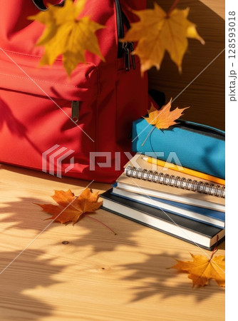 Fresh Start: New Backpack with School Supplies and Autumn Leaves Fresh Start: New Backpack with School Supplies and Autumn Leaves 128593018