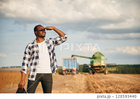Beautiful African American man is in the agricultural field 128593440